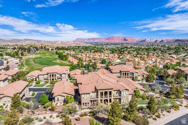 drone / aerial view featuring a residential view and a mountain view