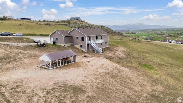 bird's eye view with a rural view and a mountain view