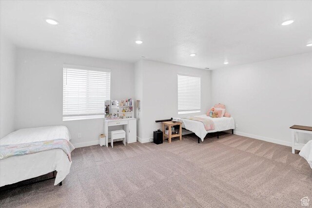 carpeted bedroom with baseboards and recessed lighting