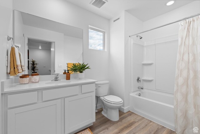 419 S 1130 W Unit 208, American Fork, UT 84003 - full bathroom with shower / bath combo, visible vents, toilet, vanity, and wood finished floors