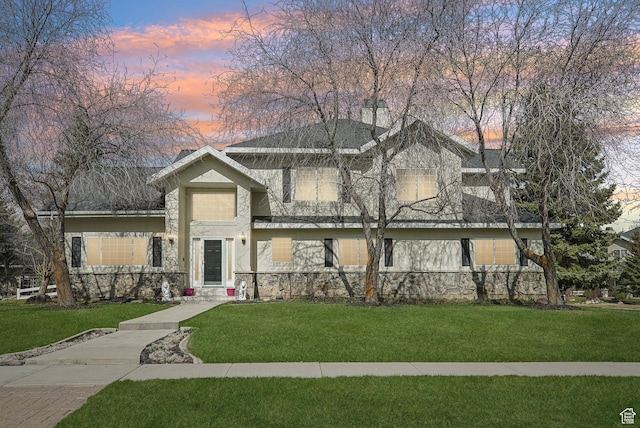 1367 W Settlement Dr, Park City, UT 84098 - view of front of property featuring a chimney, a front yard, stone siding, and stucco siding