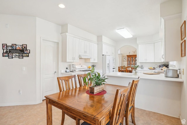 1367 W Settlement Dr, Park City, UT 84098 - dining space with baseboards, recessed lighting, arched walkways, and light floors