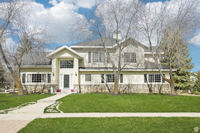 1367 W Settlement Dr, Park City, UT 84098 - view of front of property with a front yard, a chimney, stone siding, and stucco siding