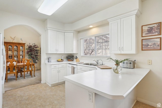 1367 W Settlement Dr, Park City, UT 84098 - kitchen with a peninsula, light countertops, a sink, and white cabinetry