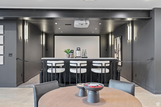 home theater featuring recessed lighting and a dry bar