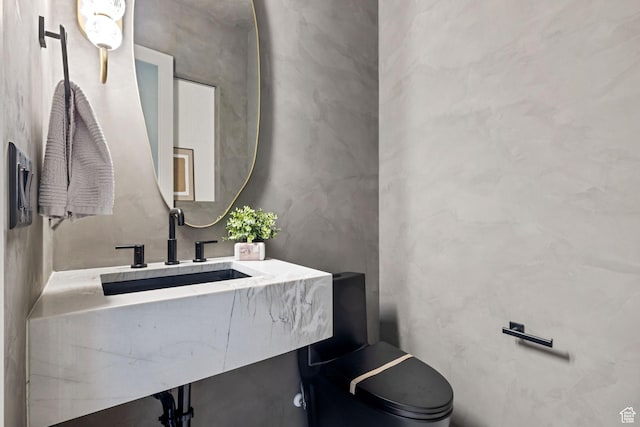 half bath featuring vanity