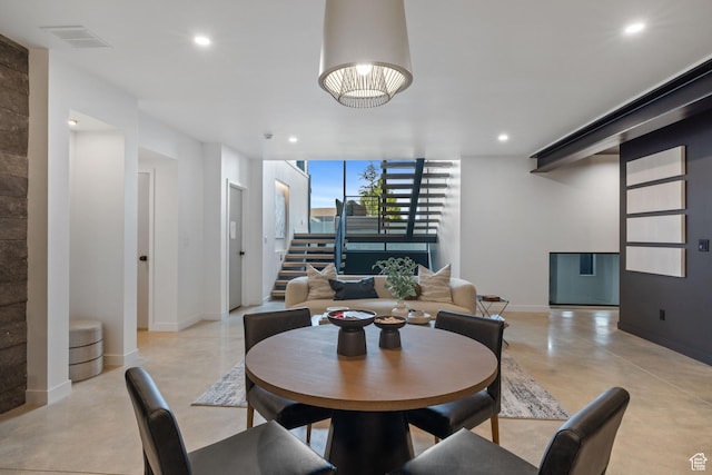 dining room with recessed lighting, finished concrete flooring, baseboards, and visible vents