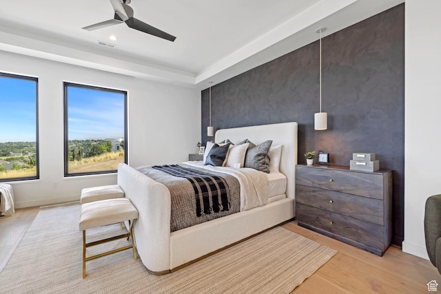 bedroom featuring visible vents, baseboards, ceiling fan, light wood-type flooring, and recessed lighting