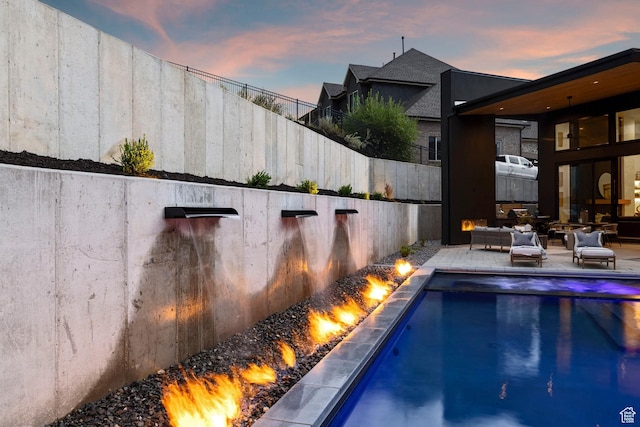 view of pool with a fenced in pool, a patio, a fenced backyard, and an outdoor hangout area