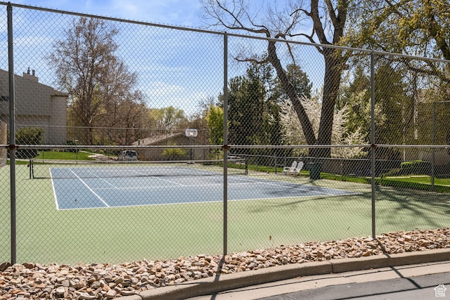 view of sport court with fence
