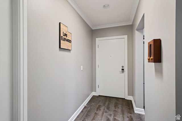 doorway to outside with crown molding, baseboards, and dark wood finished floors