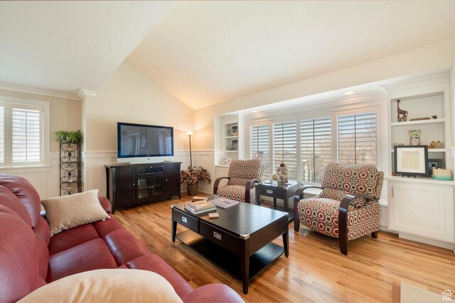 1960 S High Pointe St E Unit 22, Bountiful, UT 84010 - living room with built in shelves, a decorative wall, crown molding, light wood finished floors, and wainscoting