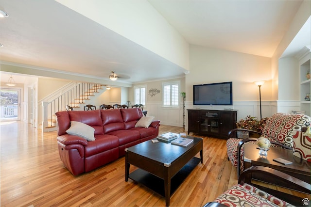 1960 S High Pointe St E Unit 22, Bountiful, UT 84010 - living room with crown molding, a wainscoted wall, wood finished floors, lofted ceiling, and stairs