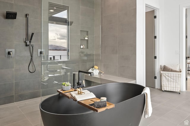 1582 S Wiltshire Ln, Saratoga Springs, UT 84045 - full bath featuring a freestanding tub, a water view, tile walls, a walk in shower, and tile patterned flooring