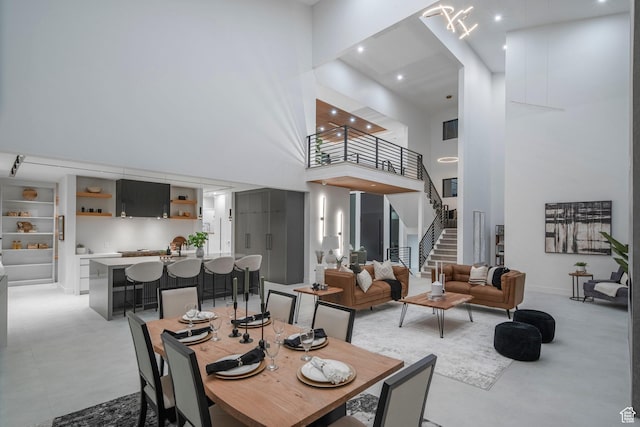 1582 S Wiltshire Ln, Saratoga Springs, UT 84045 - dining room with a high ceiling, recessed lighting, and stairway