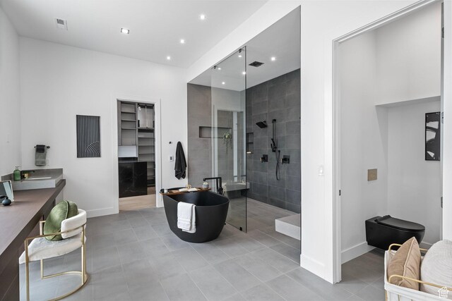 1582 S Wiltshire Ln, Saratoga Springs, UT 84045 - full bathroom with a walk in shower, a freestanding tub, tile patterned flooring, recessed lighting, and baseboards