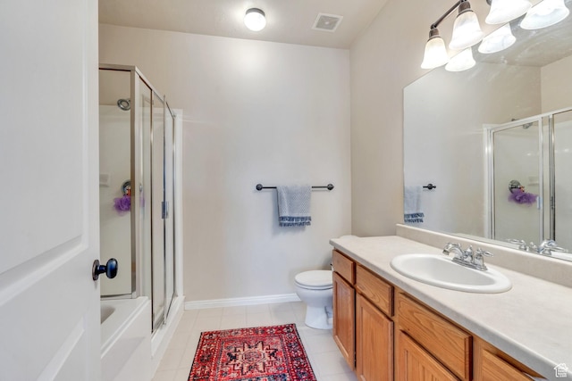 bathroom with vanity, a stall shower, tile patterned floors, toilet, and visible vents