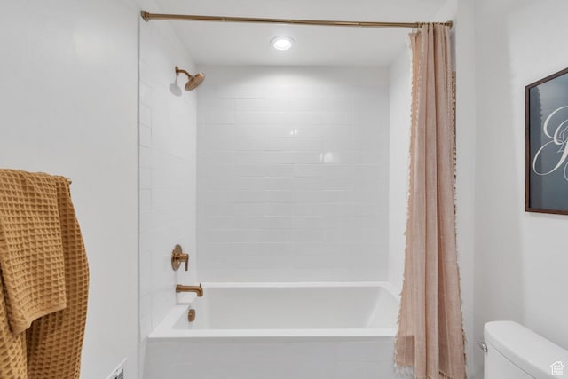 full bathroom featuring shower / bath combo and toilet