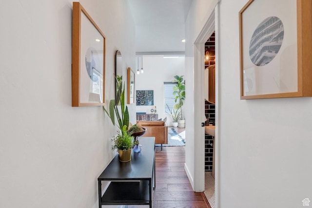 corridor with wood-type flooring