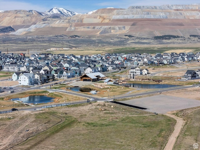 bird's eye view featuring a water and mountain view and a residential view