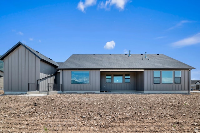 1489 E 820 N Unit 104, Salem, UT 84653 - rear view of property with board and batten siding and a shingled roof