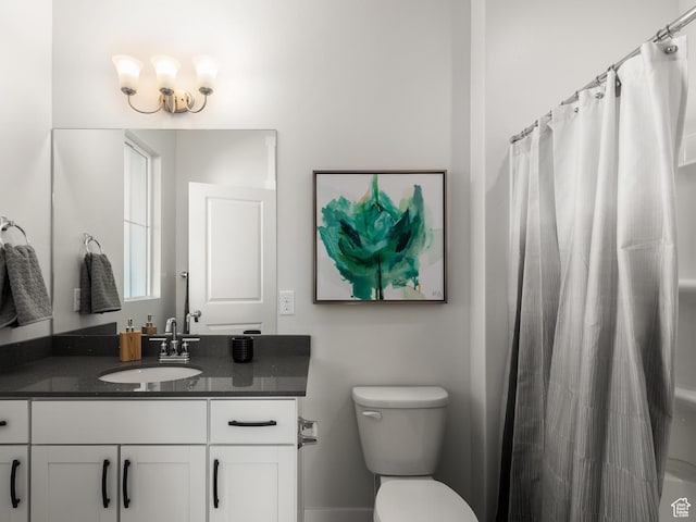 bathroom with vanity, a shower with curtain, and toilet