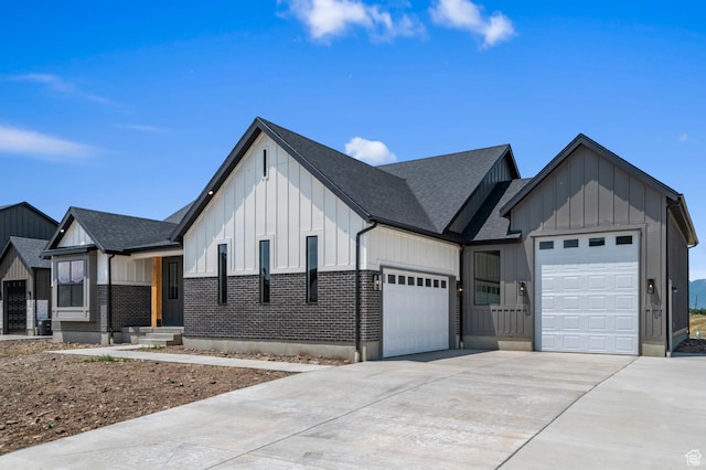 1489 E 820 N Unit 104, Salem, UT 84653 - modern farmhouse style home with board and batten siding, an attached garage, driveway, and a shingled roof