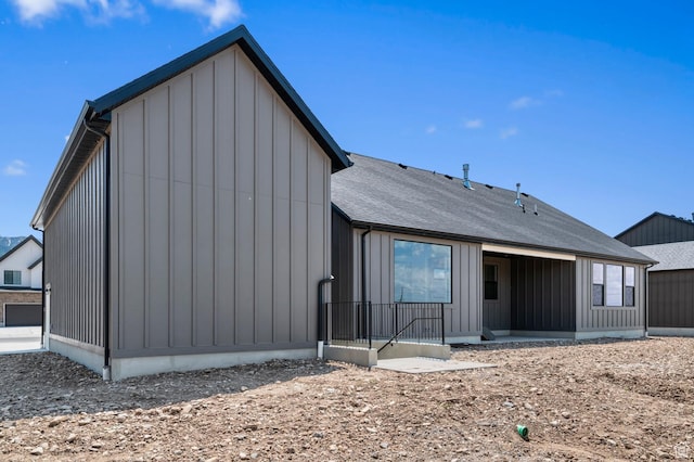 1489 E 820 N Unit 104, Salem, UT 84653 - rear view of property with board and batten siding and roof with shingles