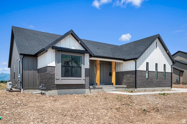 1489 E 820 N Unit 104, Salem, UT 84653 - modern inspired farmhouse with board and batten siding, a shingled roof, and brick siding