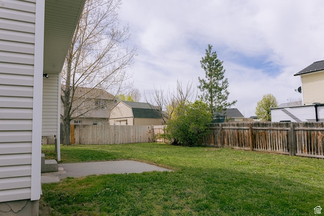 view of yard with a fenced backyard