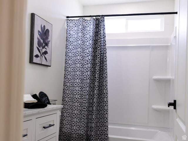 full bathroom featuring vanity and shower / bath combination with curtain