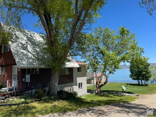 1640 S Bear Lake Blvd, Garden City, UT 84028 - view of property exterior with a lawn and a water view