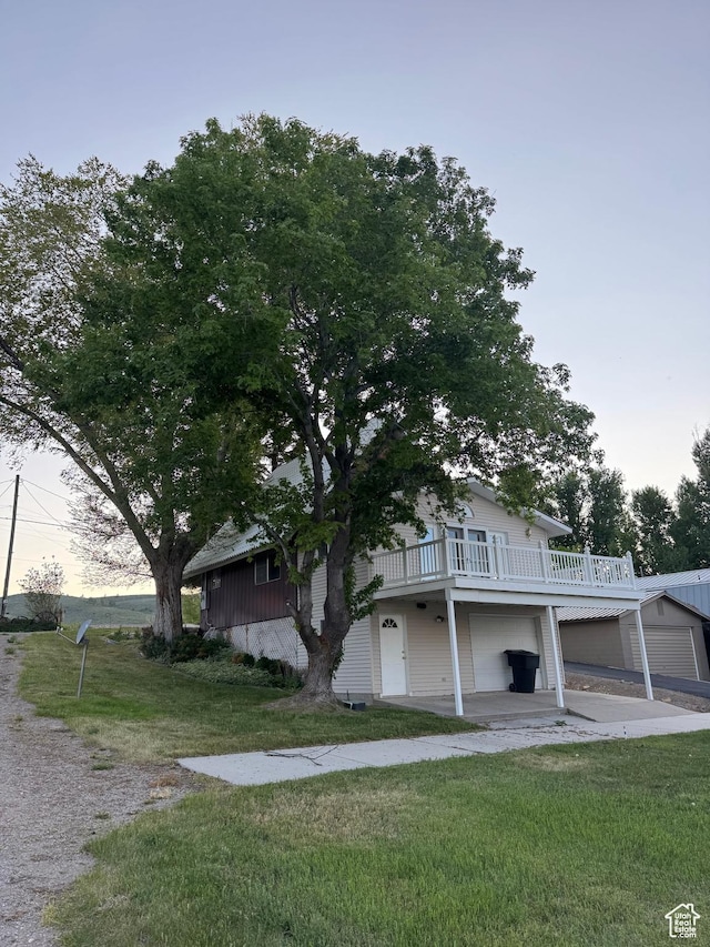 1640 S Bear Lake Blvd, Garden City, UT 84028 - view of front facade with a front yard and a wooden deck