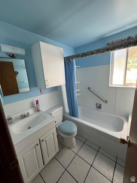 1640 S Bear Lake Blvd, Garden City, UT 84028 - full bathroom featuring vanity, tile patterned flooring, and shower / bathtub combination with curtain