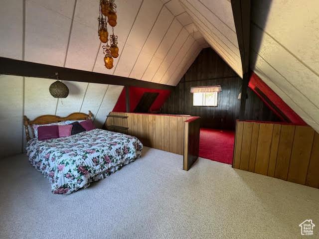1640 S Bear Lake Blvd, Garden City, UT 84028 - carpeted bedroom with wood walls and lofted ceiling