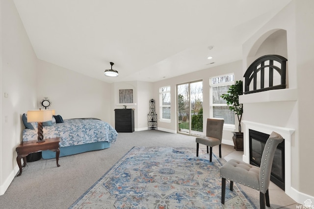 1141 S Waterside Dr, Saratoga Springs, UT 84045 - carpeted bedroom featuring baseboards and a glass covered fireplace