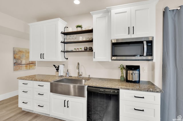 1141 S Waterside Dr, Saratoga Springs, UT 84045 - kitchen with white cabinets, open shelves, dishwasher, a sink, and stainless steel microwave
