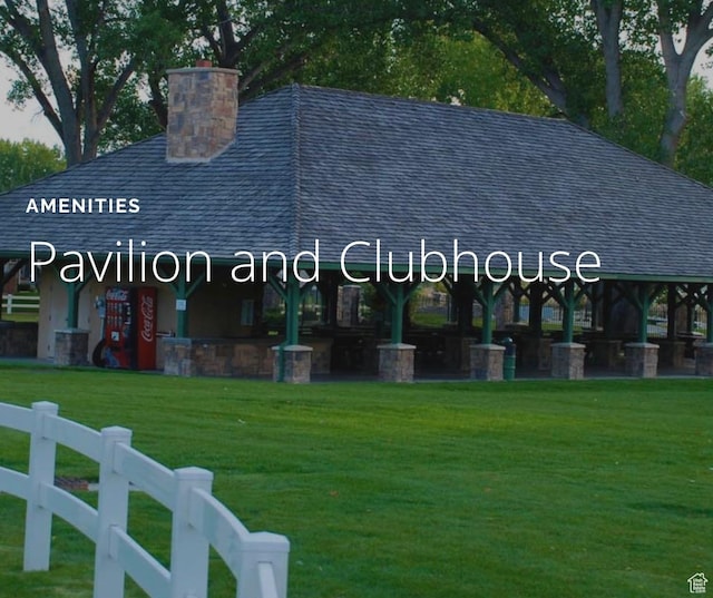 1141 S Waterside Dr, Saratoga Springs, UT 84045 - exterior space featuring roof with shingles, a lawn, and a chimney