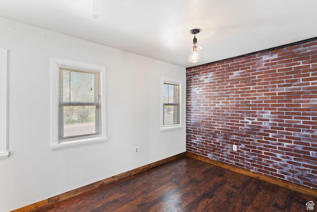 3478 S 500 E, South Salt Lake, UT 84106 - empty room with brick wall, plenty of natural light, and dark wood-style flooring