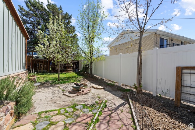 3478 S 500 E, South Salt Lake, UT 84106 - fenced backyard with an outdoor fire pit and a patio
