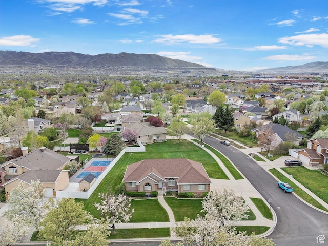 birds eye view of property with a residential view and a mountain view