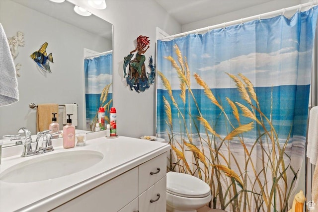 full bathroom with vanity and toilet