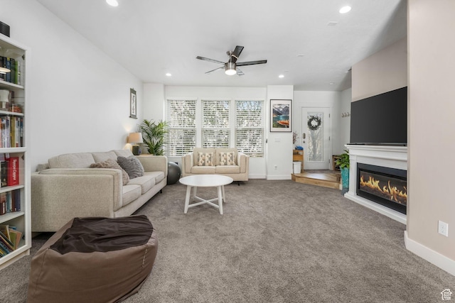 11407 S Oswego Ln, South Jordan, UT 84009 - carpeted living room with a glass covered fireplace, recessed lighting, and ceiling fan