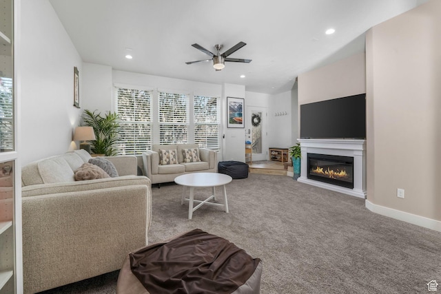 11407 S Oswego Ln, South Jordan, UT 84009 - carpeted living room with a glass covered fireplace, recessed lighting, baseboards, and ceiling fan