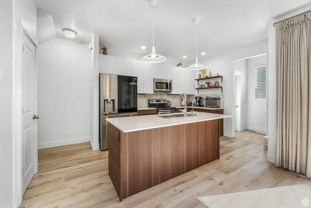 11407 S Oswego Ln, South Jordan, UT 84009 - kitchen featuring light wood-style flooring, light countertops, open shelves, stainless steel appliances, and a sink