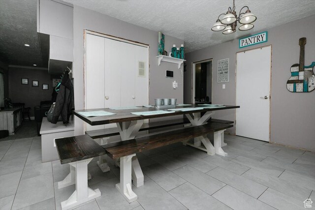 95 S 200 W, Lewiston, UT 84320 - dining space with a textured ceiling, a notable chandelier, and visible vents