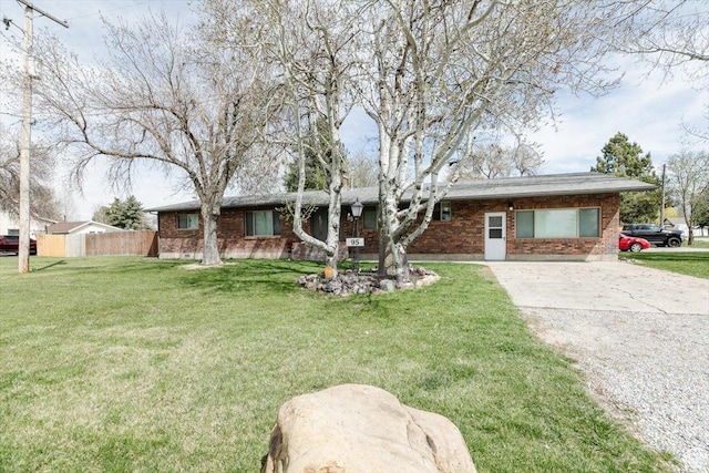 95 S 200 W, Lewiston, UT 84320 - single story home featuring brick siding, driveway, fence, and a front lawn