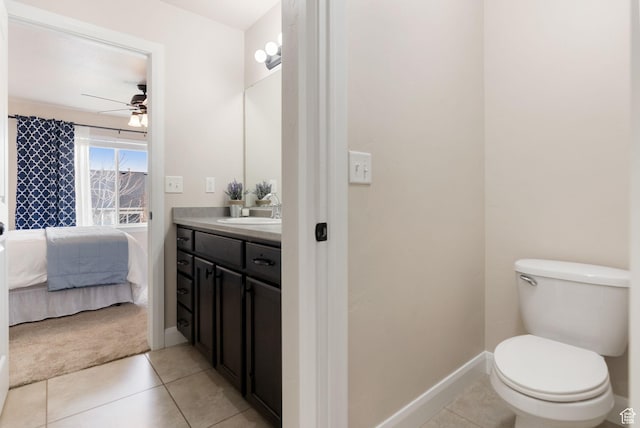 ensuite bathroom featuring a ceiling fan, connected bathroom, tile patterned flooring, and vanity