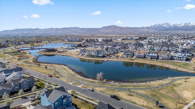 aerial view with a water and mountain view and a residential view