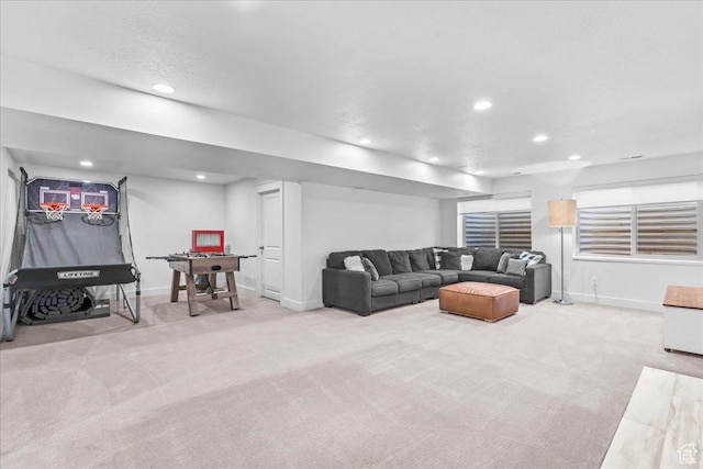 living area featuring carpet floors, baseboards, and recessed lighting